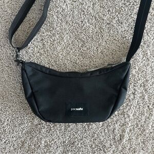 PACSAFE— Anti Theft Lunar Crossbody